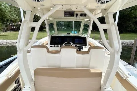 Seas Today Yacht Photos Pics 2019 Scout 355 LXF boat interior with helm, seating, and navigation equipment.
