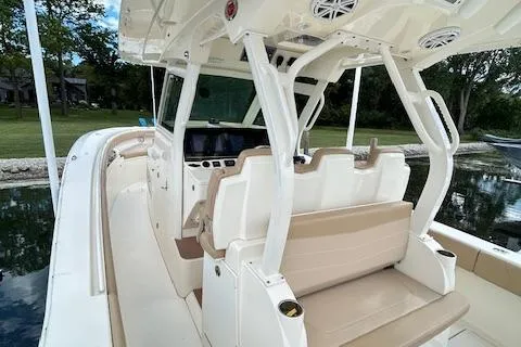 Seas Today Yacht Photos Pics 2019 Scout 355 LXF boat interior with beige seating and modern dashboard.
