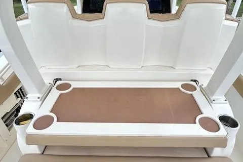 Seas Today Yacht Photos Pics 2019 Scout 355 LXF boat seating area with integrated cup holders.