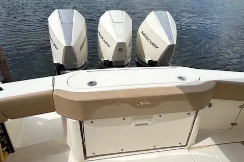 Seas Today Yacht Photos Pics 2019 Scout 355 LXF boat with triple Mercury outboard engines on water.