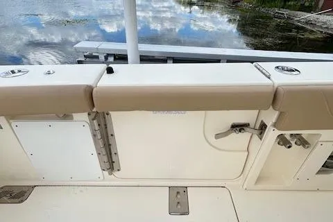 Seas Today Yacht Photos Pics 2019 Scout 355 LXF boat interior with beige seating and water reflection.