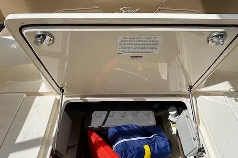 Seas Today Yacht Photos Pics 2019 Scout 355 LXF storage compartment with safety equipment and gear.
