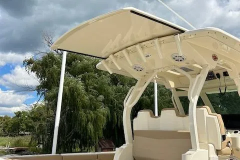 Seas Today Yacht Photos Pics 2019 Scout 355 LXF boat with sleek design and modern features, under a cloudy sky.