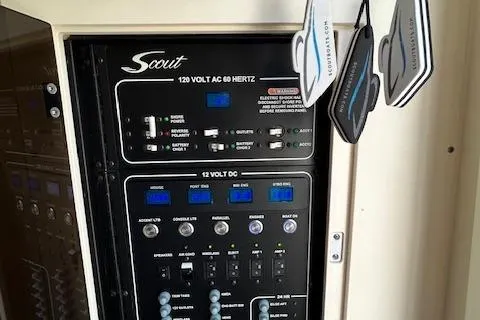 Seas Today Yacht Photos Pics Control panel of 2019 Scout 355 LXF boat with hanging air fresheners.