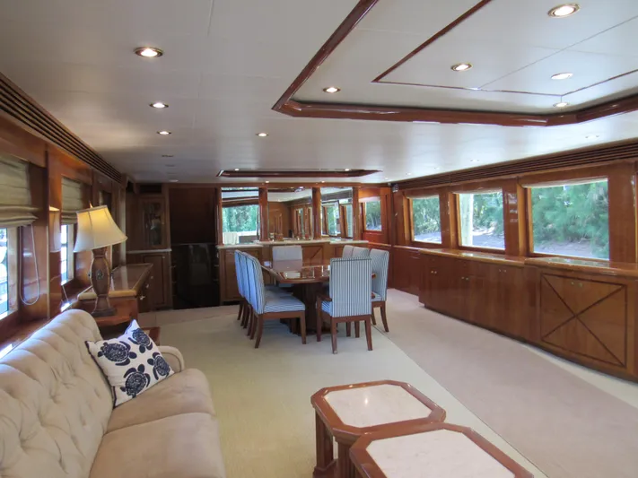 Sanctuary Yacht Photos Pics Luxurious interior of 2002 Hargrave Raised Pilothouse yacht with elegant dining area and plush seating.