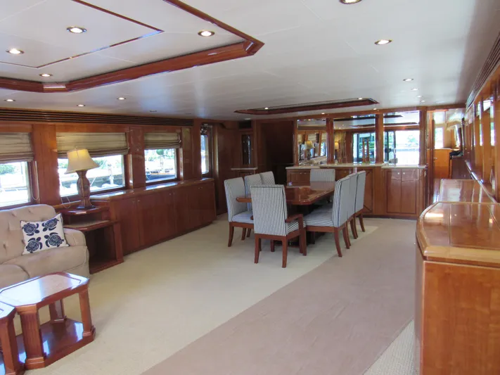 Sanctuary Yacht Photos Pics Luxurious interior of 2002 Hargrave Raised Pilothouse yacht with elegant dining area and wood finishes.