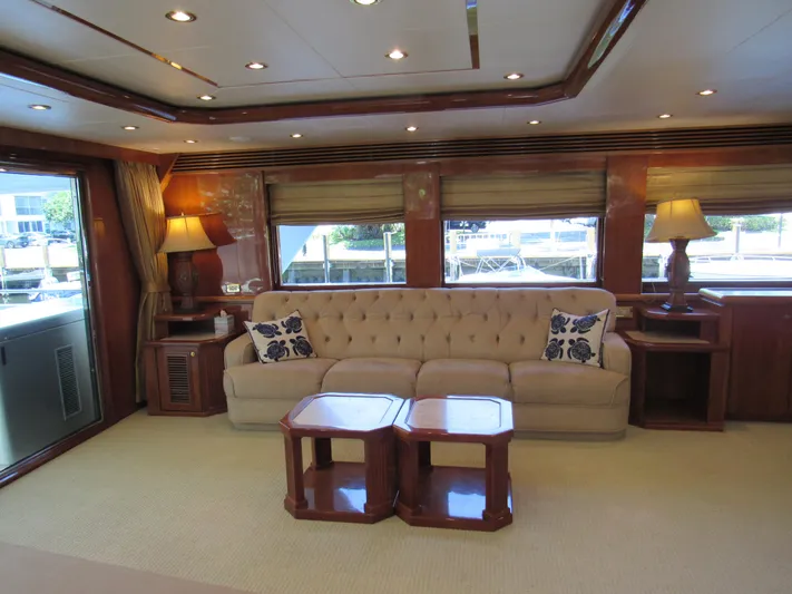 Sanctuary Yacht Photos Pics Luxurious 2002 Hargrave Raised Pilothouse yacht interior with elegant sofa and wooden accents.
