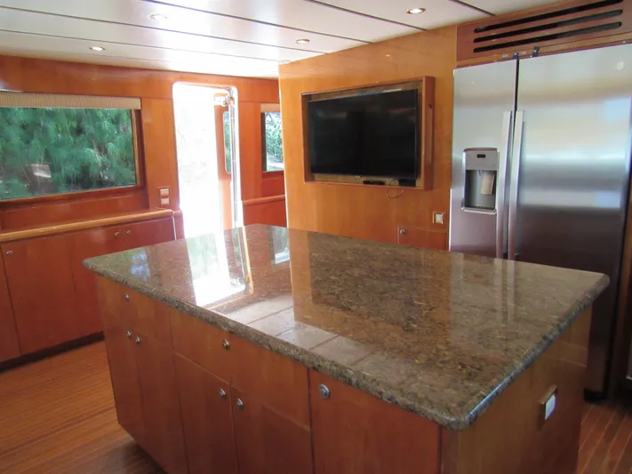 Sanctuary Yacht Photos Pics Luxurious kitchen interior of 2002 Hargrave Raised Pilothouse yacht with granite countertop.