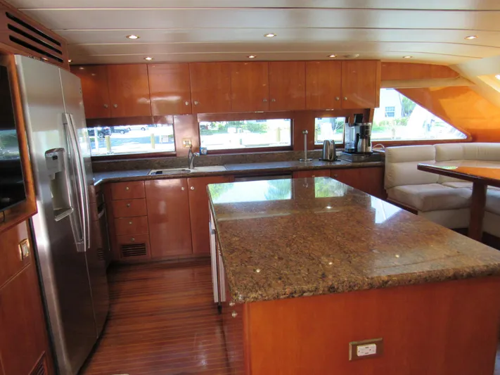 Sanctuary Yacht Photos Pics Luxurious kitchen interior of 2002 Hargrave Raised Pilothouse yacht with granite countertops.