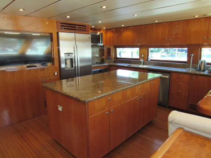 Sanctuary Yacht Photos Pics Luxurious kitchen interior of 2002 Hargrave Raised Pilothouse yacht with modern appliances.