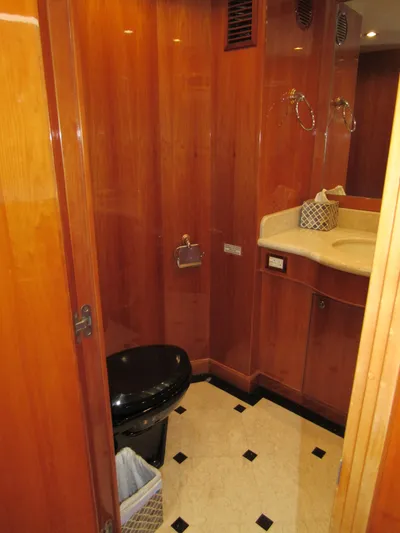 Sanctuary Yacht Photos Pics Luxurious bathroom in 2002 Hargrave Raised Pilothouse yacht with wood paneling and modern fixtures.