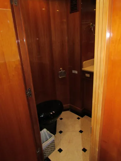 Sanctuary Yacht Photos Pics Luxurious bathroom in 2002 Hargrave Raised Pilothouse yacht with wood paneling and elegant fixtures.