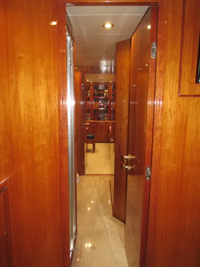 Sanctuary Yacht Photos Pics Luxurious wooden interior of a 2002 Hargrave Raised Pilothouse yacht hallway.