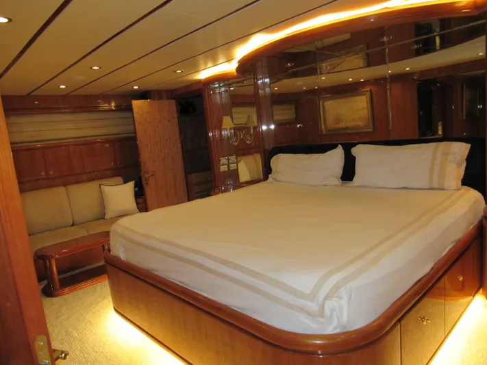 Sanctuary Yacht Photos Pics Luxurious bedroom interior of 2002 Hargrave Raised Pilothouse yacht with elegant wood finishes.