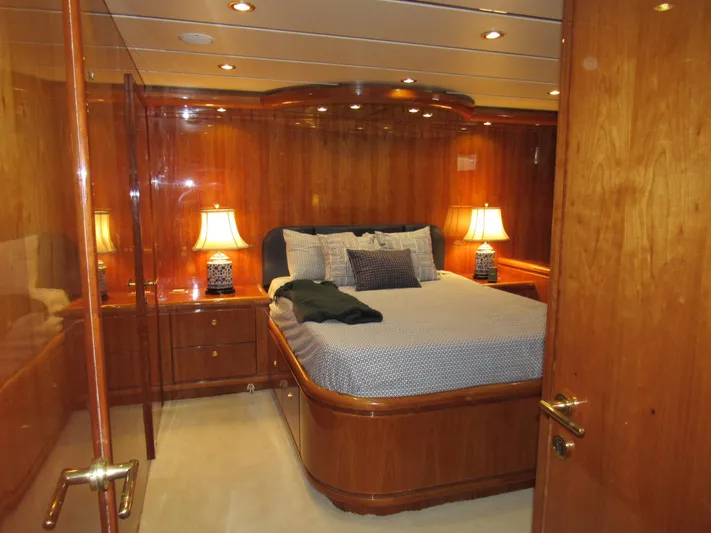 Sanctuary Yacht Photos Pics Luxurious wooden cabin interior of 2002 Hargrave Raised Pilothouse yacht with elegant bedding.