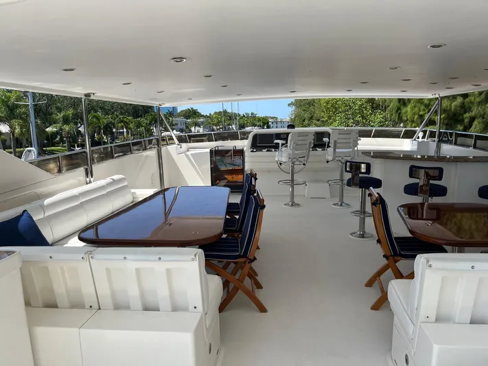 Sanctuary Yacht Photos Pics Luxurious 2002 Hargrave Raised Pilothouse yacht deck with seating and tables.