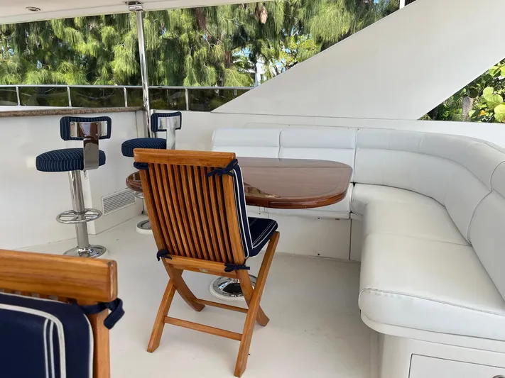 Sanctuary Yacht Photos Pics Luxurious 2002 Hargrave Raised Pilothouse yacht deck with seating and table.