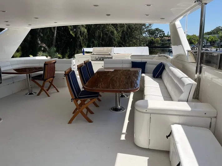 Sanctuary Yacht Photos Pics Luxurious 2002 Hargrave Raised Pilothouse yacht deck with elegant seating and dining area.