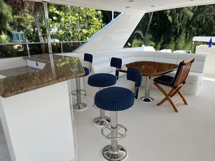 Sanctuary Yacht Photos Pics Luxurious 2002 Hargrave Raised Pilothouse yacht deck with seating and bar area.