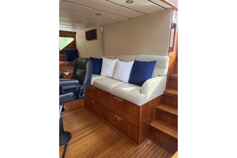 Sanctuary Yacht Photos Pics Luxurious interior of 2002 Hargrave Raised Pilothouse yacht with plush seating and wooden accents.