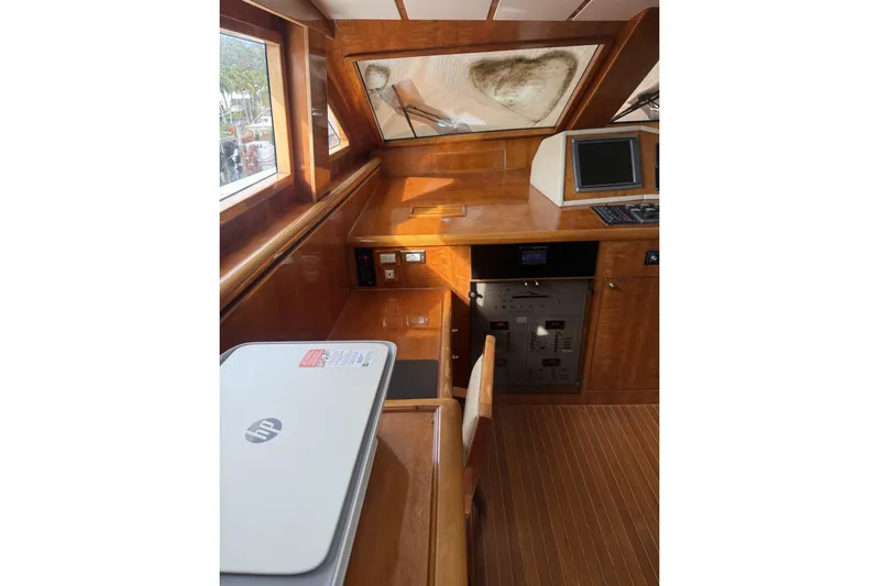 Sanctuary Yacht Photos Pics 2002 Hargrave Raised Pilothouse interior with wooden finish and navigation equipment.