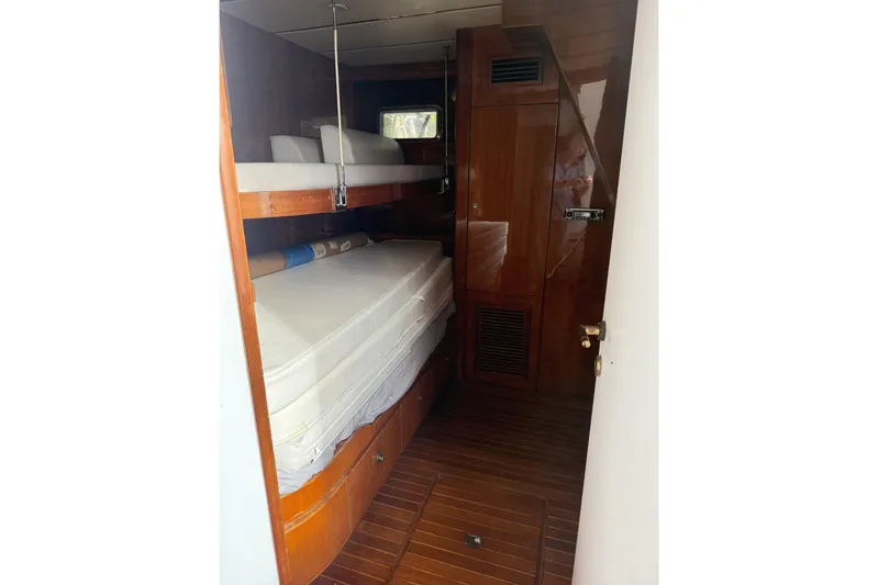 Sanctuary Yacht Photos Pics 2002 Hargrave Raised Pilothouse yacht cabin with wooden interior and bunk beds.