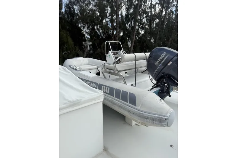 Sanctuary Yacht Photos Pics Inflatable boat with Yamaha motor on 2002 Hargrave Raised Pilothouse yacht deck.