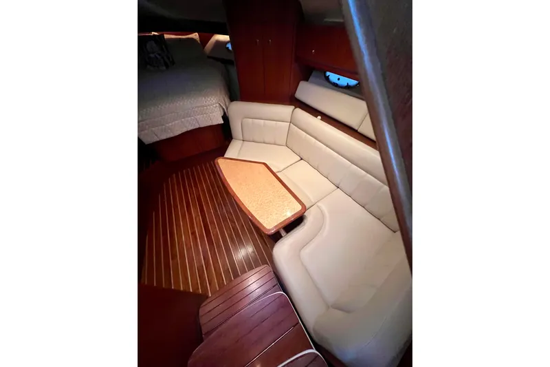 Blue Pearl Yacht Photos Pics Luxurious interior of 2005 Tiara Yachts 3200 Open with elegant seating and wooden flooring.