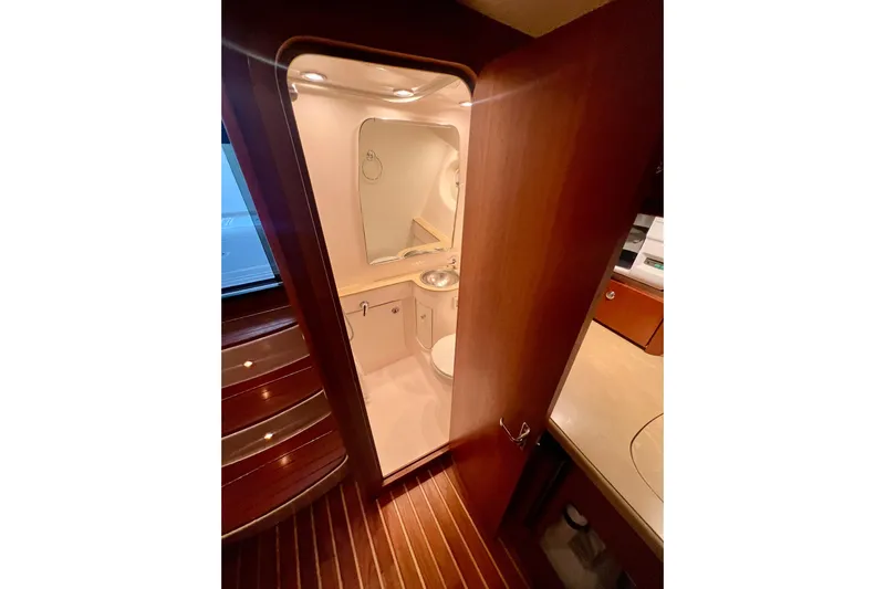 Blue Pearl Yacht Photos Pics 2005 Tiara Yachts 3200 Open bathroom interior with wood accents and modern fixtures.