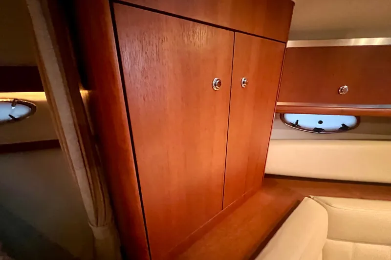 Blue Pearl Yacht Photos Pics 2005 Tiara Yachts 3200 Open interior with wooden cabinetry and seating.