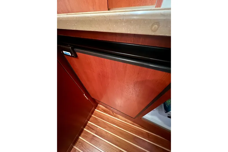 Blue Pearl Yacht Photos Pics 2005 Tiara Yachts 3200 Open interior with wooden cabinetry and flooring.