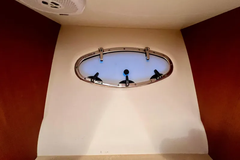 Blue Pearl Yacht Photos Pics Oval porthole inside 2005 Tiara Yachts 3200 Open, featuring a sleek, modern design.