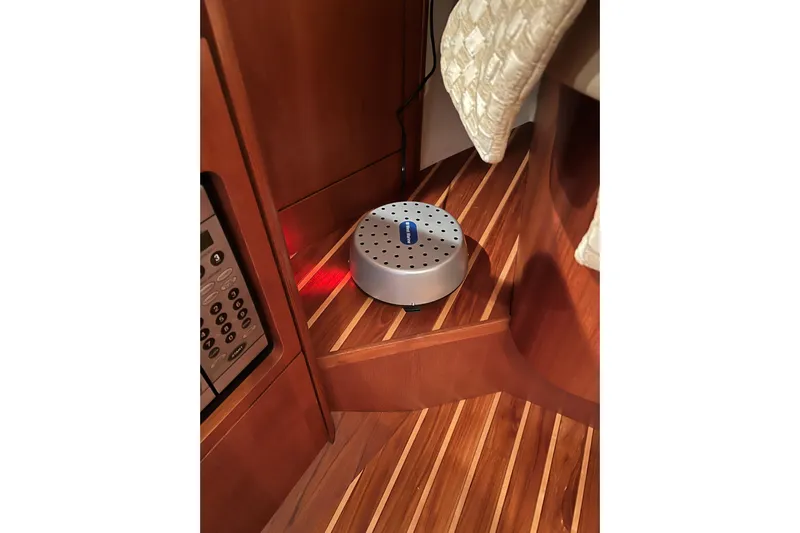 Blue Pearl Yacht Photos Pics 2005 Tiara Yachts 3200 Open interior with wooden flooring and electronic device.