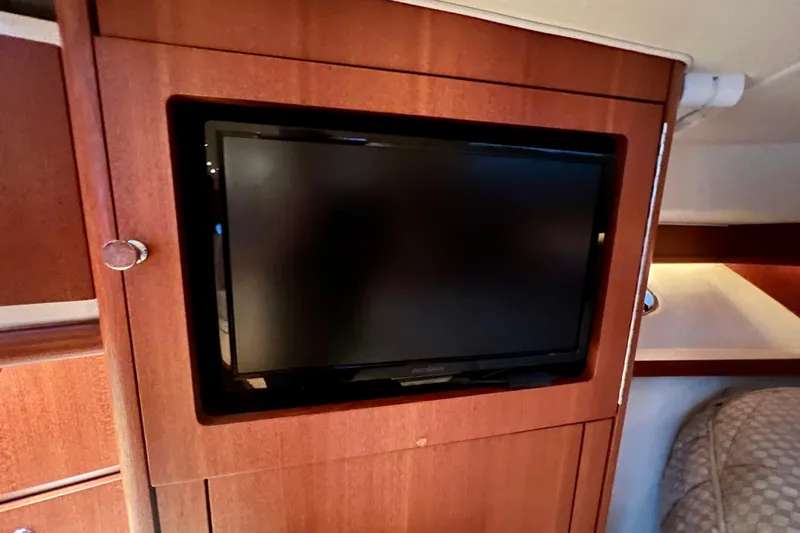 Blue Pearl Yacht Photos Pics Flat-screen TV in 2005 Tiara Yachts 3200 Open cabin interior.