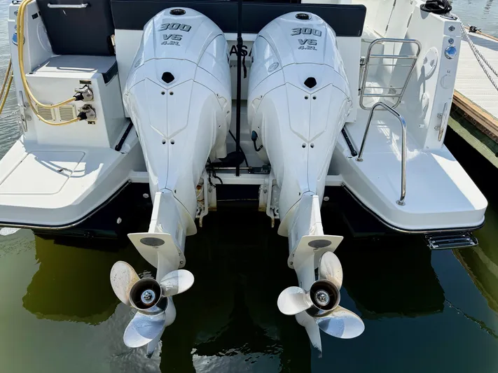 Remotely Workin' Yacht Photos Pics Twin 300 HP outboard engines on 2022 Jeanneau NC 1095 Coupe boat.