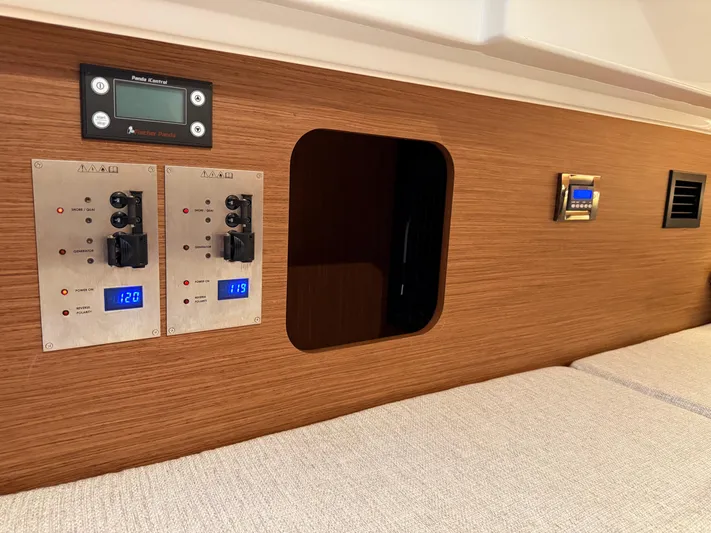 Remotely Workin' Yacht Photos Pics Control panel and interior of 2022 Jeanneau NC 1095 Coupe boat cabin.