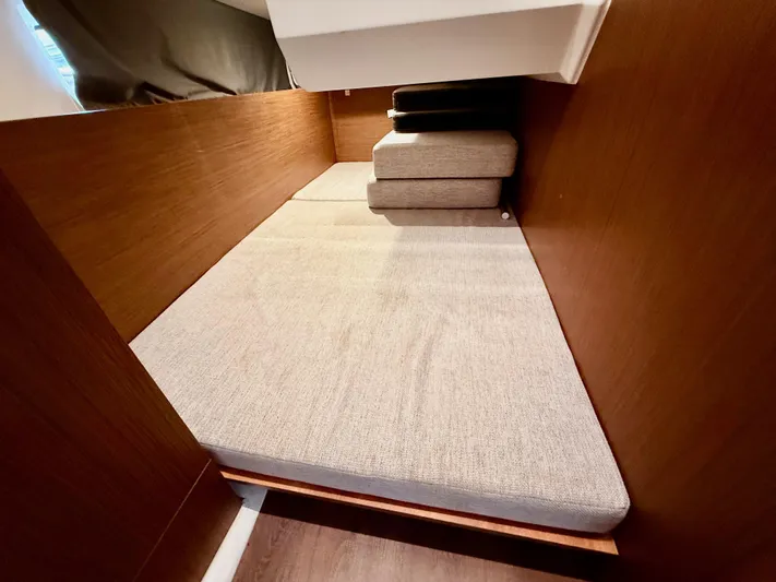 Remotely Workin' Yacht Photos Pics Interior cabin of 2022 Jeanneau NC 1095 Coupe with cushioned seating.