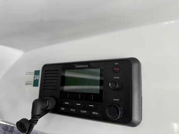 Remotely Workin' Yacht Photos Pics Garmin marine radio on 2022 Jeanneau NC 1095 Coupe boat dashboard.