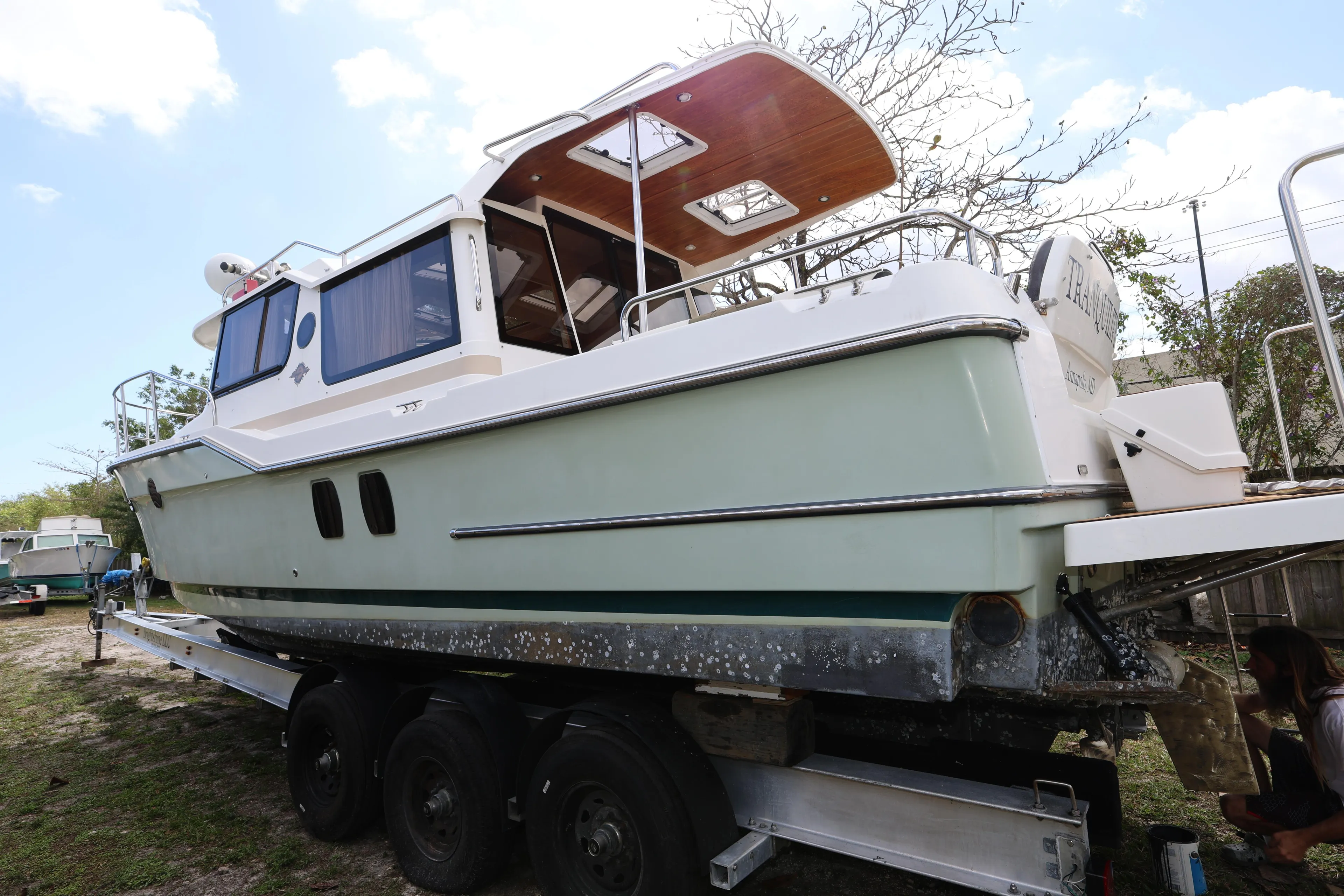 2015 Ranger Tugs R-29 S boat on trailer, side view, outdoors.
