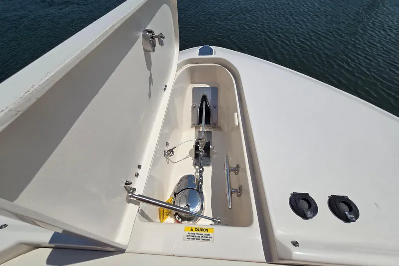  Yacht Photos Pics 2016 Grady-White Freedom 307 boat anchor compartment with open hatch, docked on water.