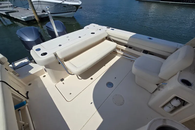  Yacht Photos Pics 2016 Grady-White Freedom 307 boat interior with seating and twin outboard motors.