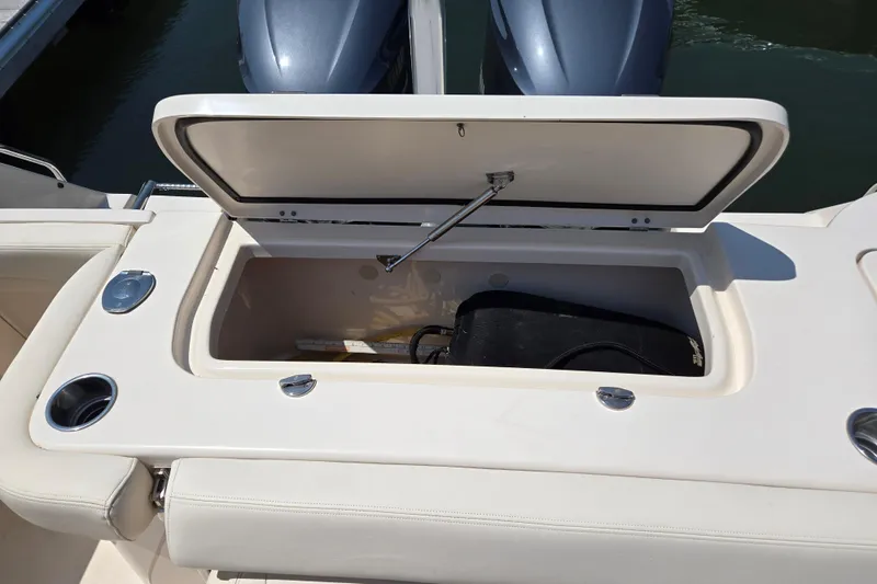  Yacht Photos Pics 2016 Grady-White Freedom 307 boat storage compartment open, showing interior space.