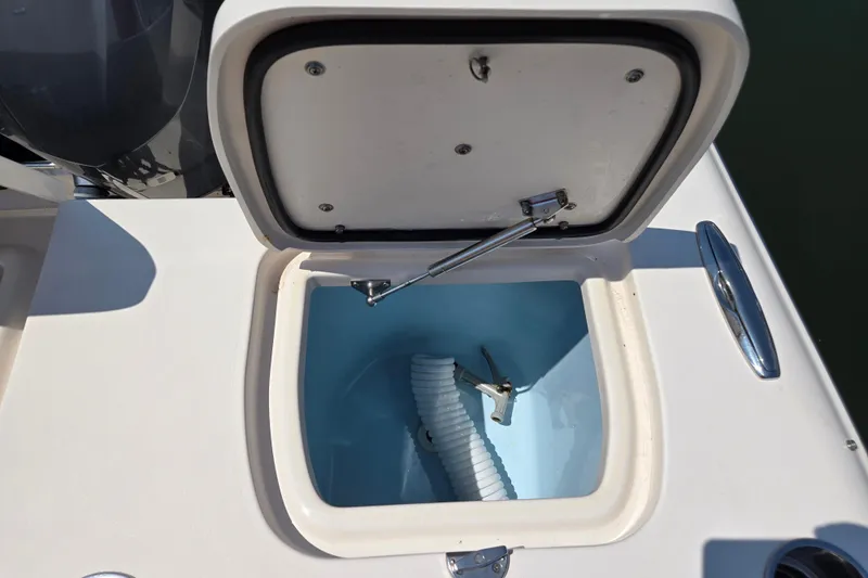  Yacht Photos Pics Open storage compartment on 2016 Grady-White Freedom 307 boat, showing interior details.