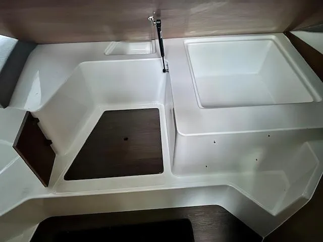  Yacht Photos Pics Interior view of a 2019 Beneteau Antares 27 boat, featuring a modern sink and storage area.