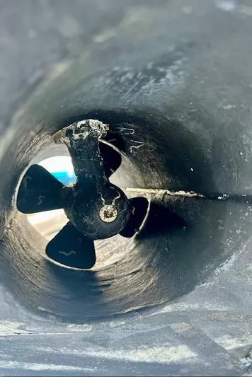  Yacht Photos Pics Close-up of a 2019 Beneteau Antares 27 boat propeller in a tunnel.