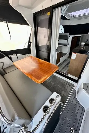  Yacht Photos Pics 2019 Beneteau Antares 27 interior with seating, table, and modern design.
