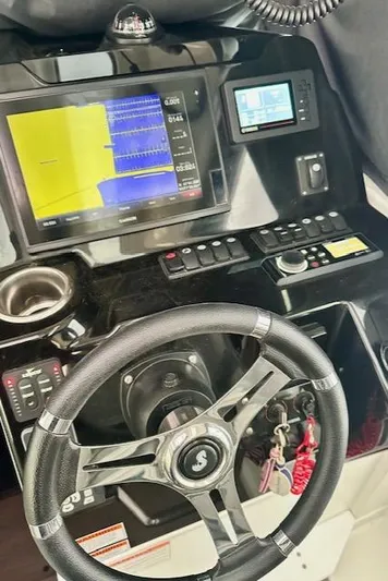  Yacht Photos Pics Dashboard of a 2019 Beneteau Antares 27 boat with navigation controls.