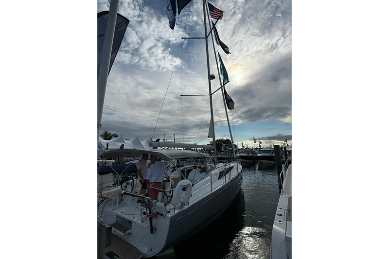 Show Boat! Special Pricing Yacht Photos Pics 2024 Beneteau Oceanis 37.1 sailboat docked under cloudy sky.
