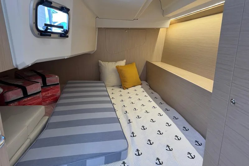 Show Boat! Special Pricing Yacht Photos Pics 2024 Beneteau Oceanis 37.1 cabin interior with cozy bedding and modern design.