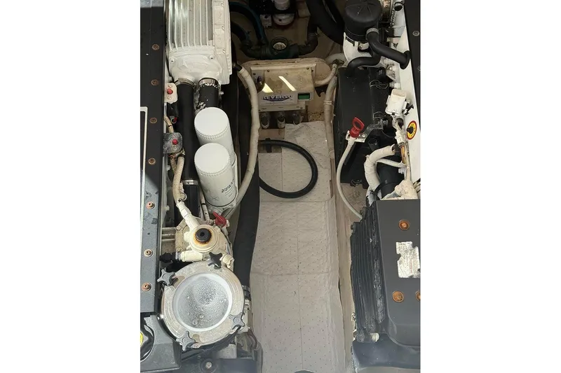 Ritz Karllton Too Yacht Photos Pics Engine compartment of 2008 Tiara Yachts 3900 Sovran, showcasing mechanical components and filters.